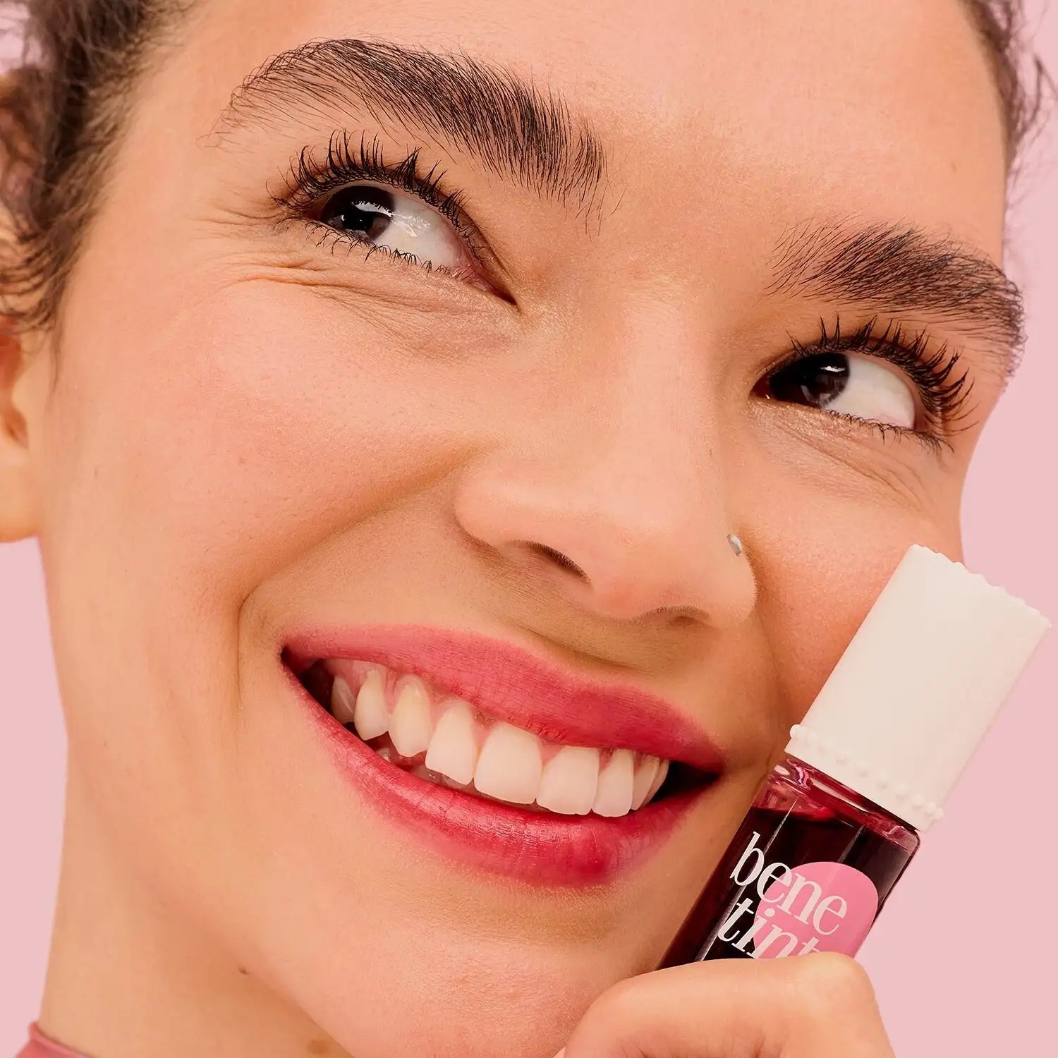 Benefit Benetint being applied on lips with brush
