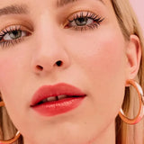 Close-up of a model's cheeks with Benefit Floratint blush application - natural flush