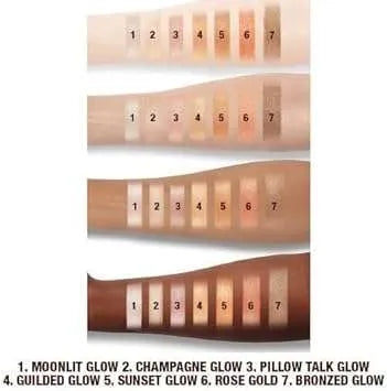 Charlotte Tilbury Moonlit Glow highlighter swatch on arm showing incandescent ivory shade
