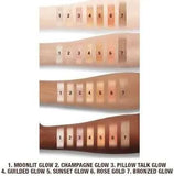 Charlotte Tilbury Moonlit Glow highlighter swatch on arm showing incandescent ivory shade