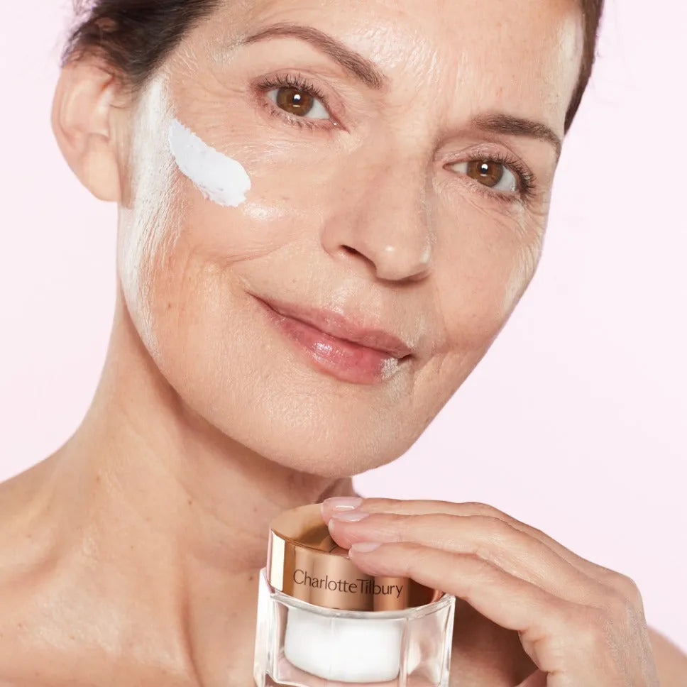 Charlotte Tilbury Magic Cream texture close-up showing creamy white consistency