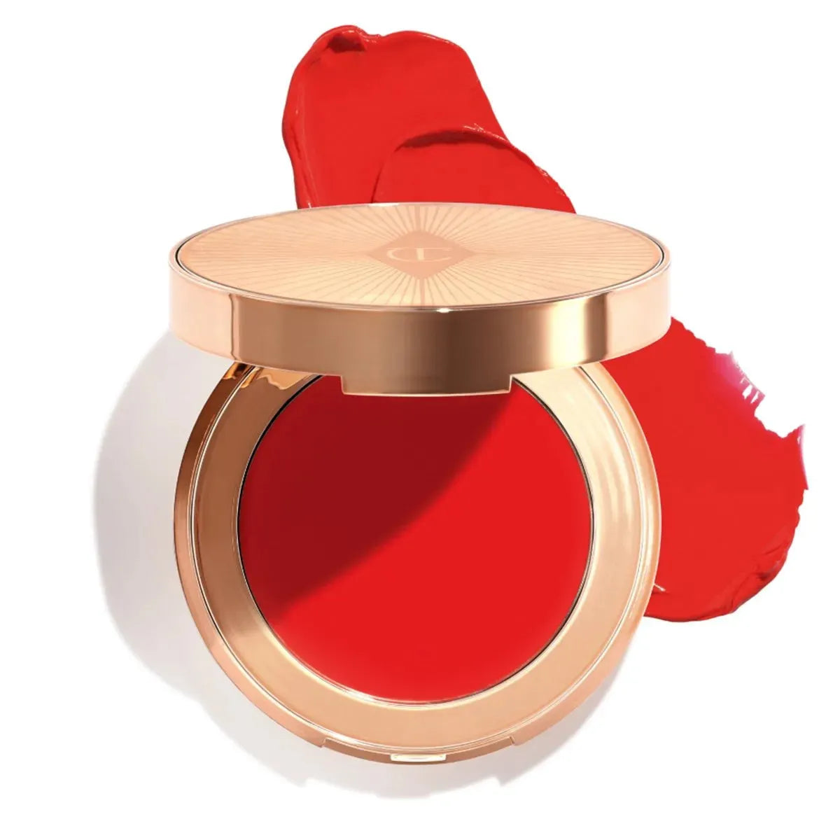 Close-up of Charlotte Tilbury Pinched Cheek Glow dewy blush swatch on cheeks showing radiant finish