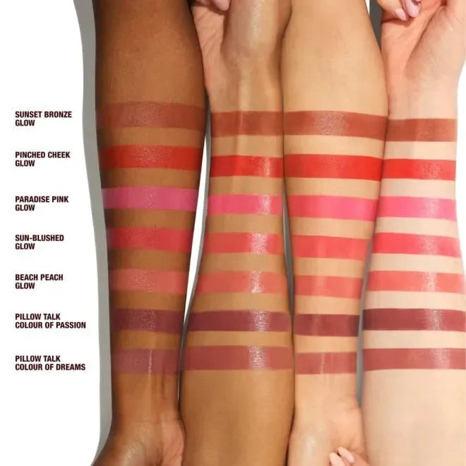 All five sun-kissed shades of Charlotte Tilbury Beautiful Skin Lip & Cheek Glow displayed together - from peach to berry