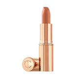 Angled view of Charlotte Tilbury Cover Star lipstick tube with cap off