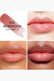 Swatch of Dior Addict Lip Glow 012 Rosewood on lips displaying sheer pink-rose custom color