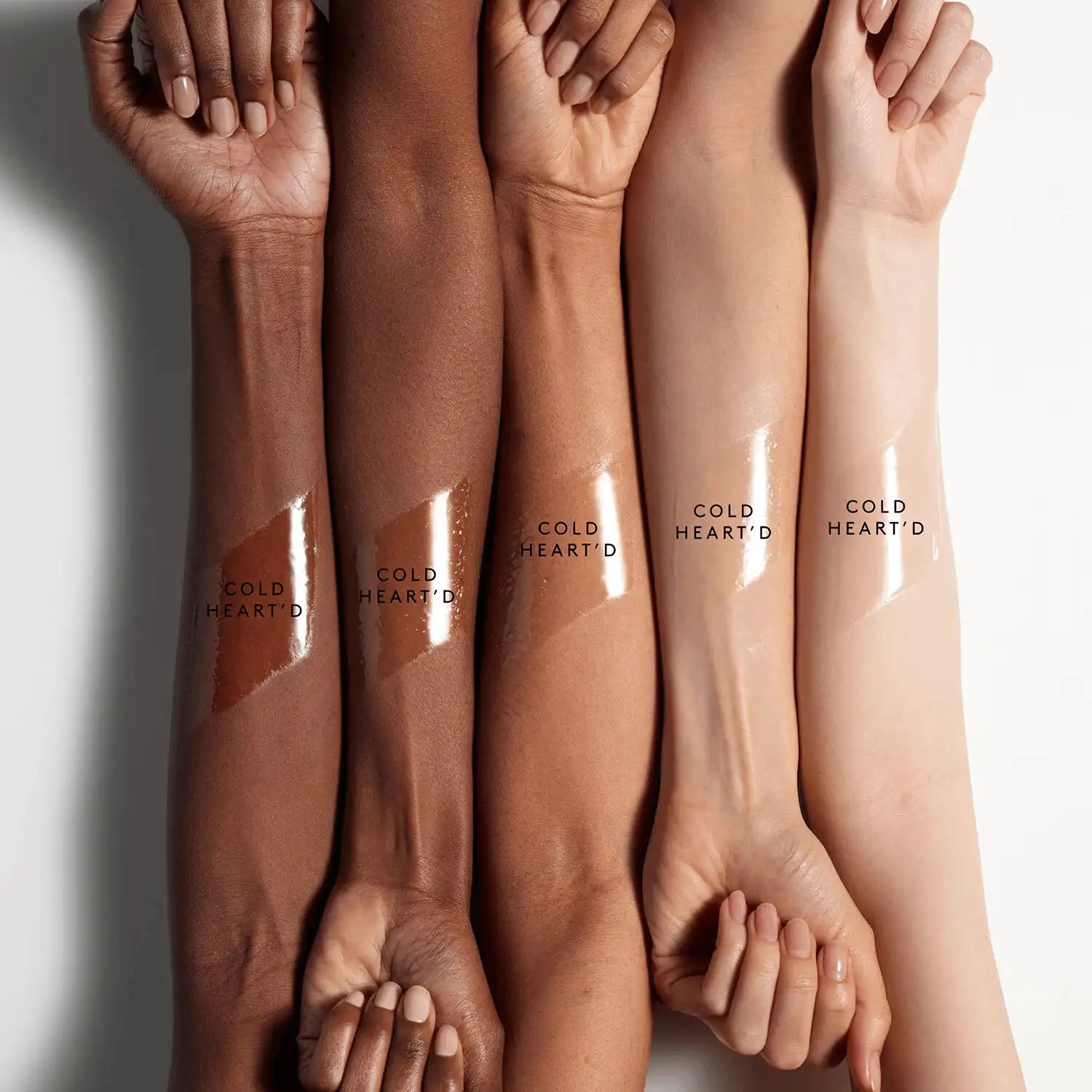 Model's lips enhanced with Fenty Beauty Gloss Bomb Ice Cold heart’d, showcasing wet-look shine and plumping effect