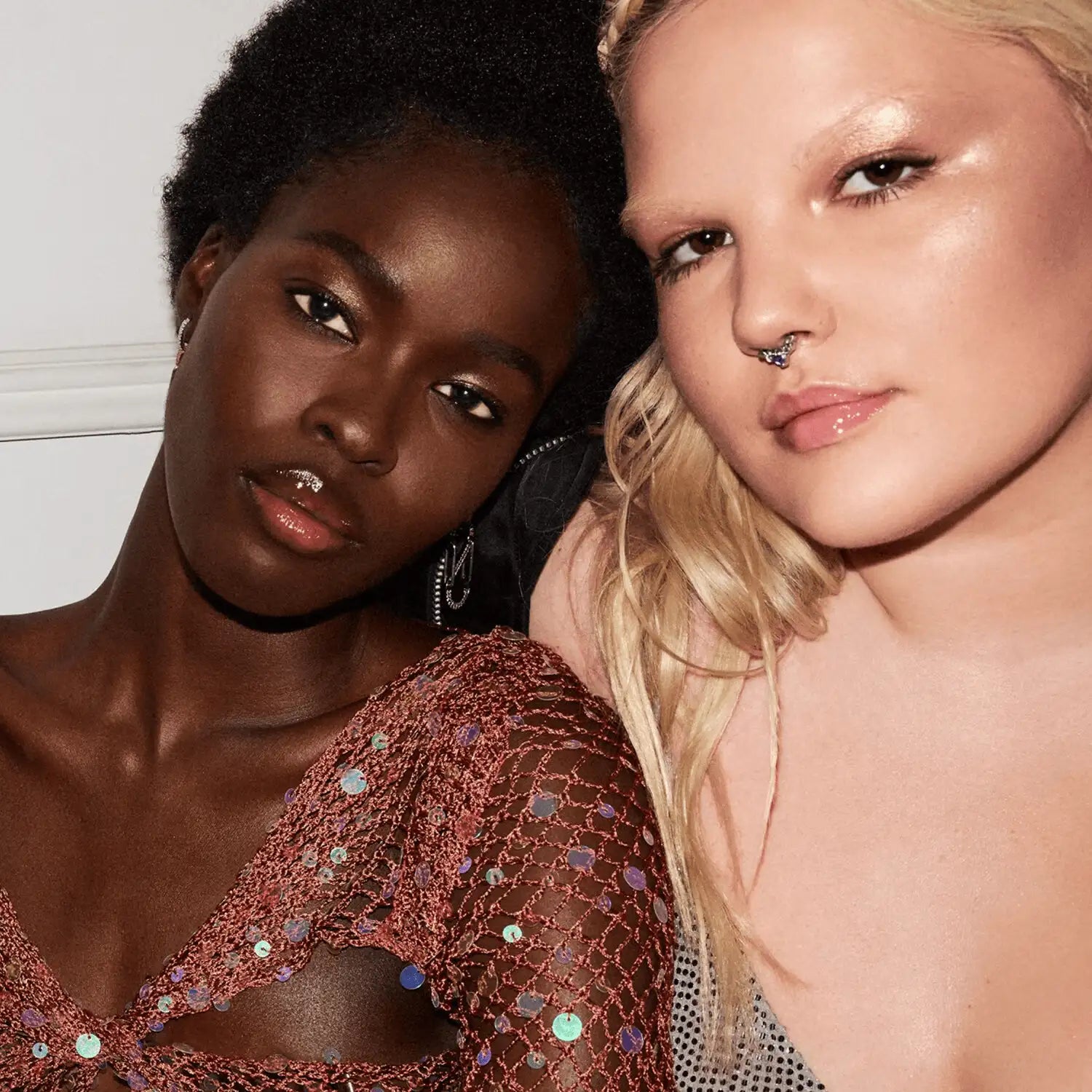 Close-up of Fenty Beauty Gloss Bomb Ice Cold heart’d XXL wand applicator, ready for one-swipe application