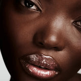 Fenty Beauty Gloss Bomb Hot Chocolit Fantasy alongside other gloss shades