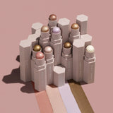 Fenty Beauty shimmer stick being applied on cheek for highlight effect