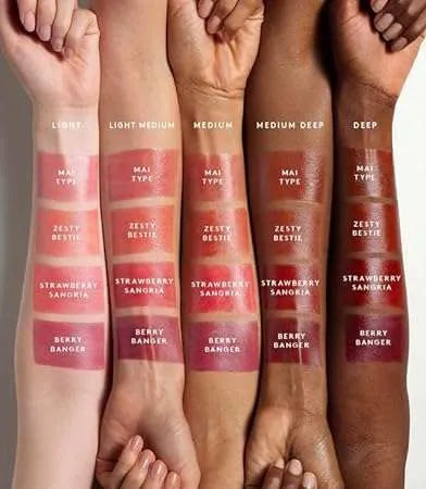 Fenty Beauty Poutsicle hydrating lip stain Zesty Bestie with other Fenty products for size reference