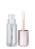 Swatch of Fenty Beauty Gloss Bomb Heat Glass Slipper on lips showing shiny finish