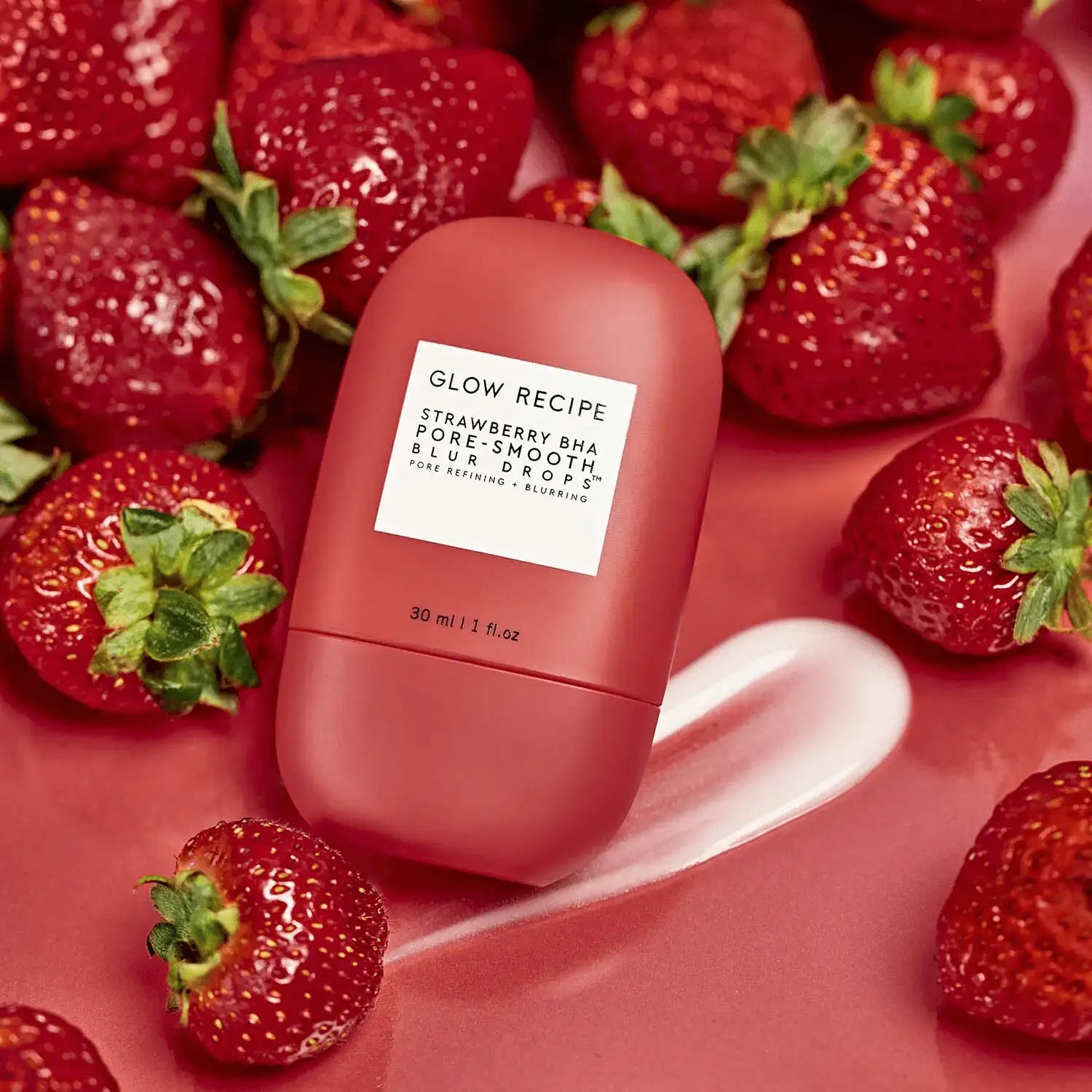 Glow Recipe Strawberry BHA Pore-Smooth Blur Drops lifestyle shot with strawberries