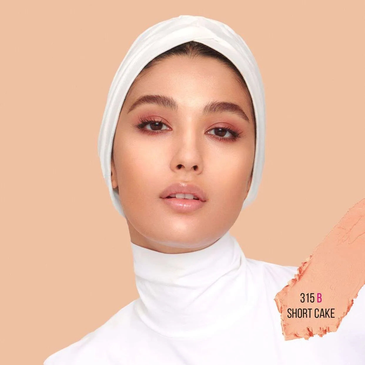 Close-up of Huda Beauty FauxFilter Skin Finish stick foundation in shade Shortcake showing texture