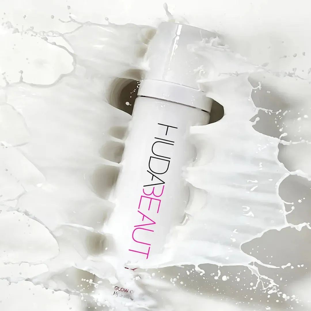 Ultra-fine milky mist of Huda Beauty Glow Coco hydrating spray with coconut water