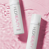 Refreshing Huda Beauty Glow Coco mist applied on face for summer hydration