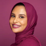 Model wearing Huda Beauty Liquid Matte lipstick Trophy Wife