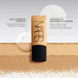 Woman applying NARS Soft Matte Complete Foundation with brush for flawless finish
