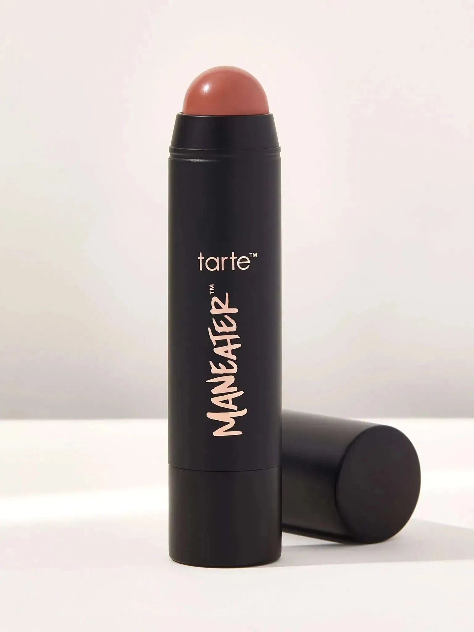 Tarte Maneater Silk Stick Blush in Buff shade - product stick and packaging on a white background, highlighting the sleek design and natural nude color