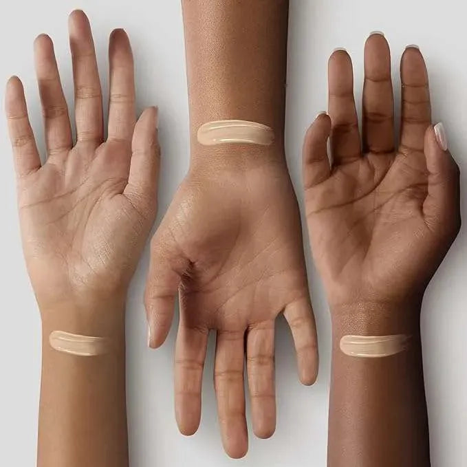 Close-up of Too Faced Born This Way Super Coverage Concealer Swan tube with doe-foot applicator, highlighting precise application for under-eye and blemishes