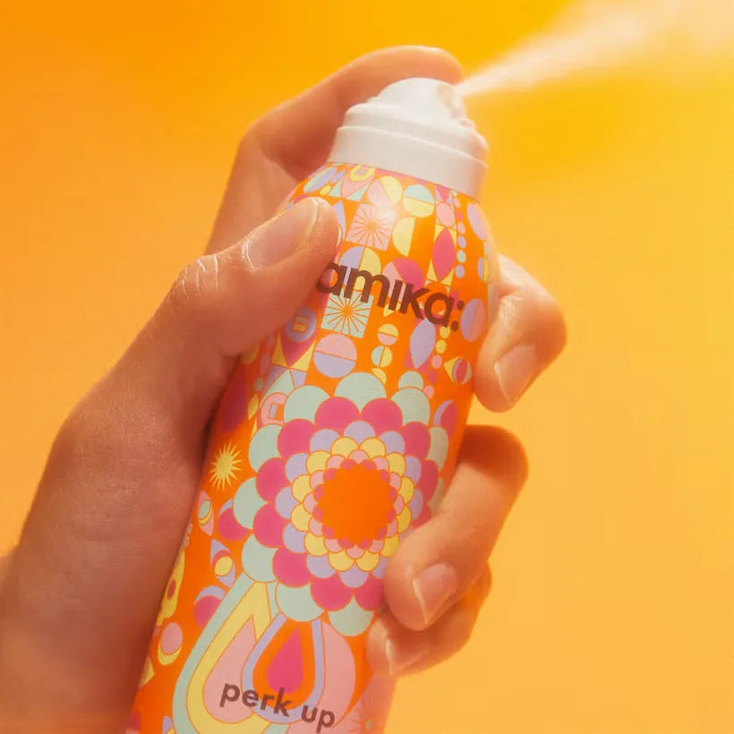 Amika Perk Up Dry Shampoo bottle, showcasing the 232ml size and colorful design.