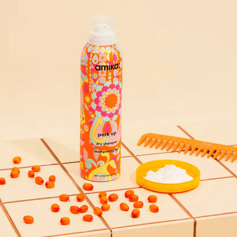 Amika Perk Up Dry Shampoo 232ml, providing a just-washed look without white residue.