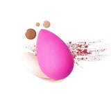 Beautyblender sponge being used to apply foundation on face for flawless finish and seamless blending