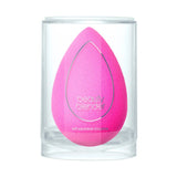Beautyblender sponge with water drops highlighting how to use damp for dewy glow makeup look