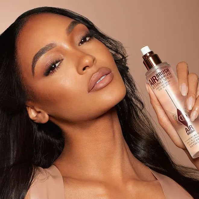 Model with flawless makeup displayed using Charlotte Tilbury Airbrush Flawless Setting Spray for long-lasting hold