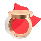 Charlotte Tilbury Lip & Cheek Glow Sun-Blushed Glow tube packaging showing creamy texture and applicator