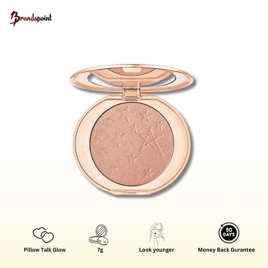 Charlotte Tilbury Hollywood Glow Glide Face Architect Highlighter in Pillow Talk Glow - front view showing compact and golden packaging