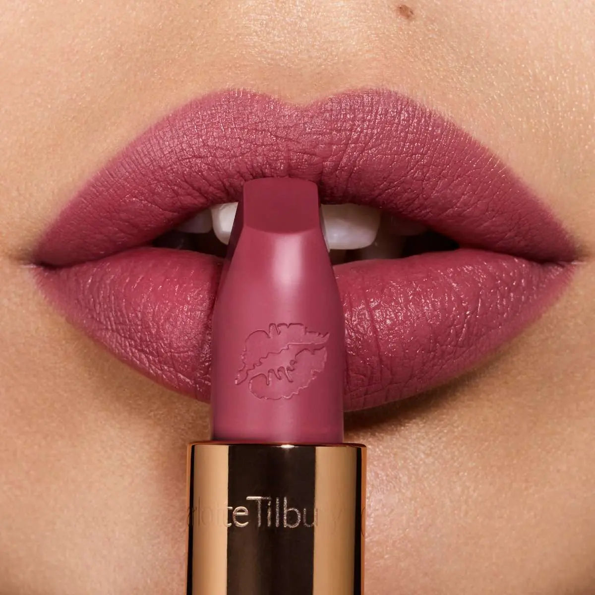 Charlotte Tilbury Hot Lips Secret Salma Lipstick - Swatch on arm showing rich plum color
