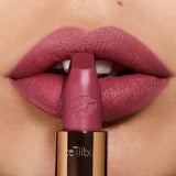 Charlotte Tilbury Hot Lips Secret Salma Lipstick - Swatch on arm showing rich plum color