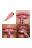 Charlotte Tilbury K.I.S.S.I.N.G Lipstick in Icon Baby rosy nude shade, applied to lips, showcasing hydrating satin finish and fuller-looking pout.