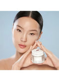 Lifestyle image of Charlotte Tilbury Magic Water Cream being applied to skin with dewy glow