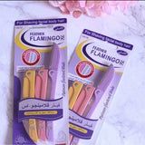 Close-up of Feather Flamingo Precision Razor blade showing safety guard and pink ergonomic handle