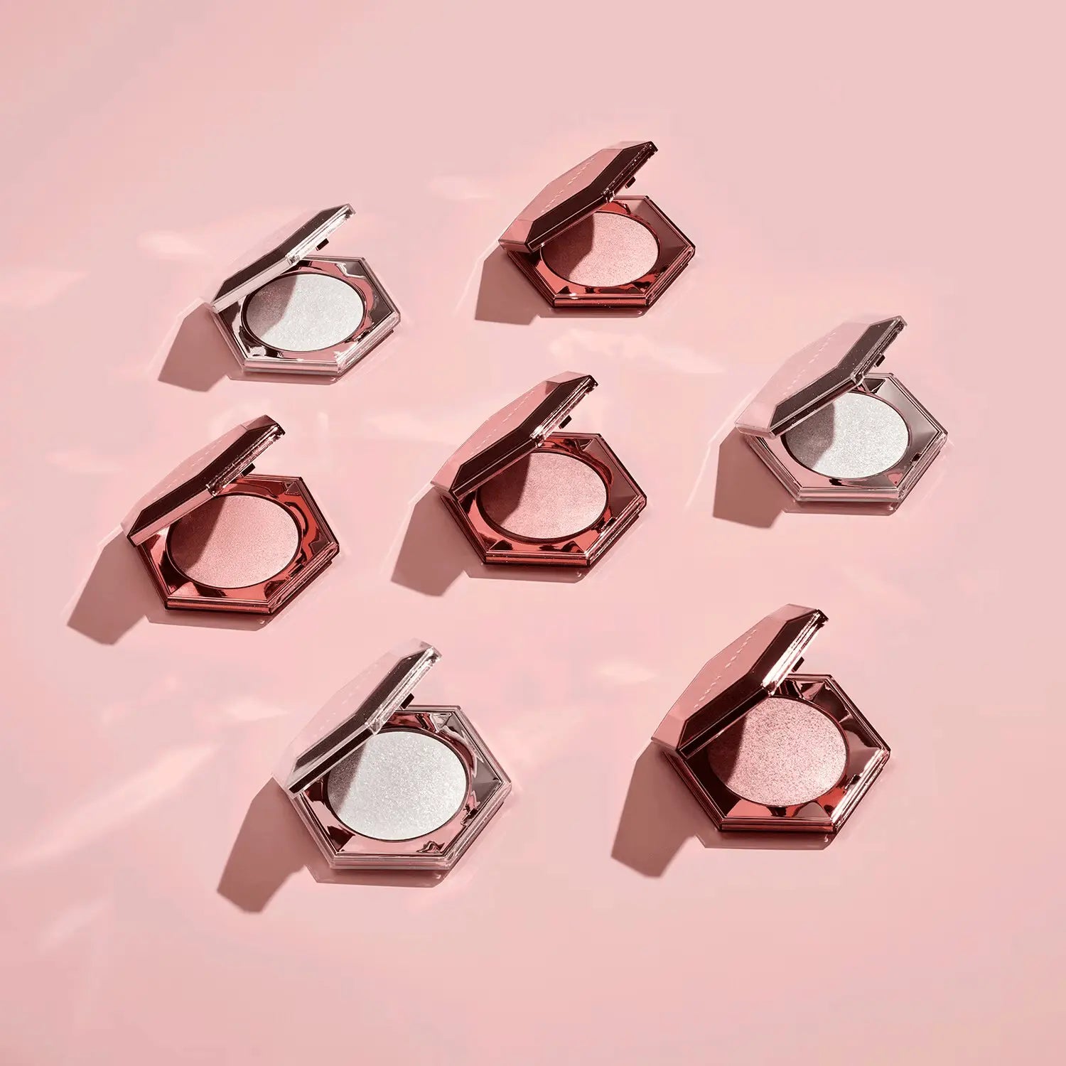 Fenty Beauty Diamond Bomb highlighter open compact showing product texture