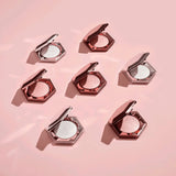Fenty Beauty Diamond Bomb highlighter open compact showing product texture