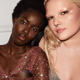 Close-up of Fenty Beauty Gloss Bomb Ice Cold heart’d XXL wand applicator, ready for one-swipe application