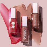 Swatch of Hot Choclit lip gloss on lips showing warm brown shade with high shine