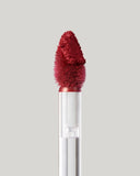Fenty Beauty Icon Velvet Liquid Lipstick The MVP applied on lips in concrete setting