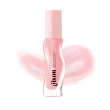 Close-up of Gisou Honey Infused Lip Oil applicator wand with strawberry sorbet tinted oil, highlighting glossy texture