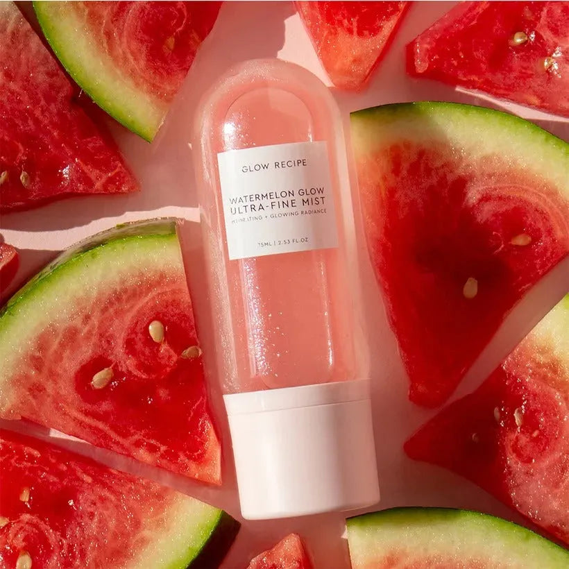 Watermelon Glow Ultra-Fine Mist ingredients and key components on marble surface