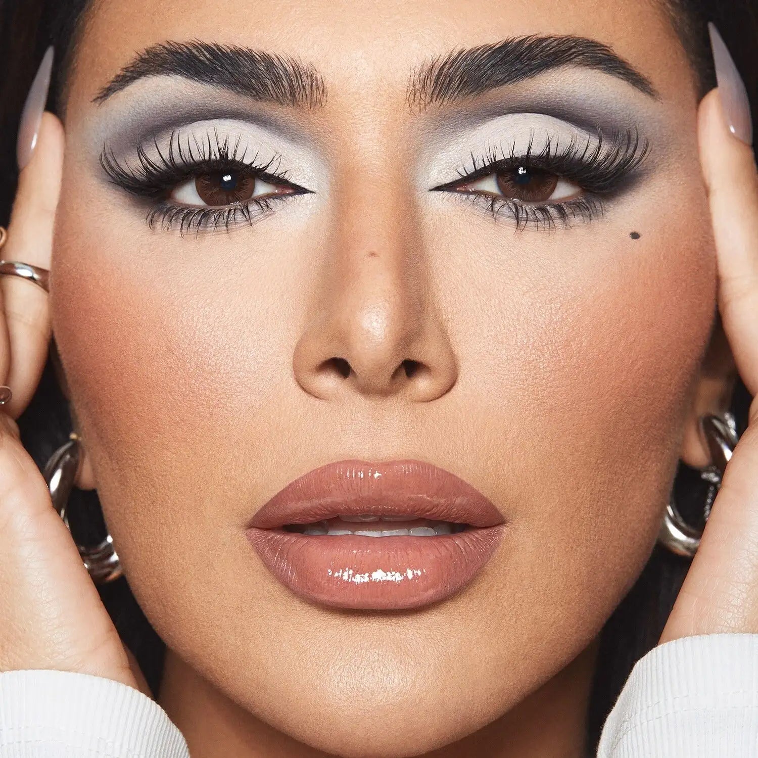 Close-up of Huda Beauty creamy eyeshadow palette Greige with marble and cream-to-metallic shades