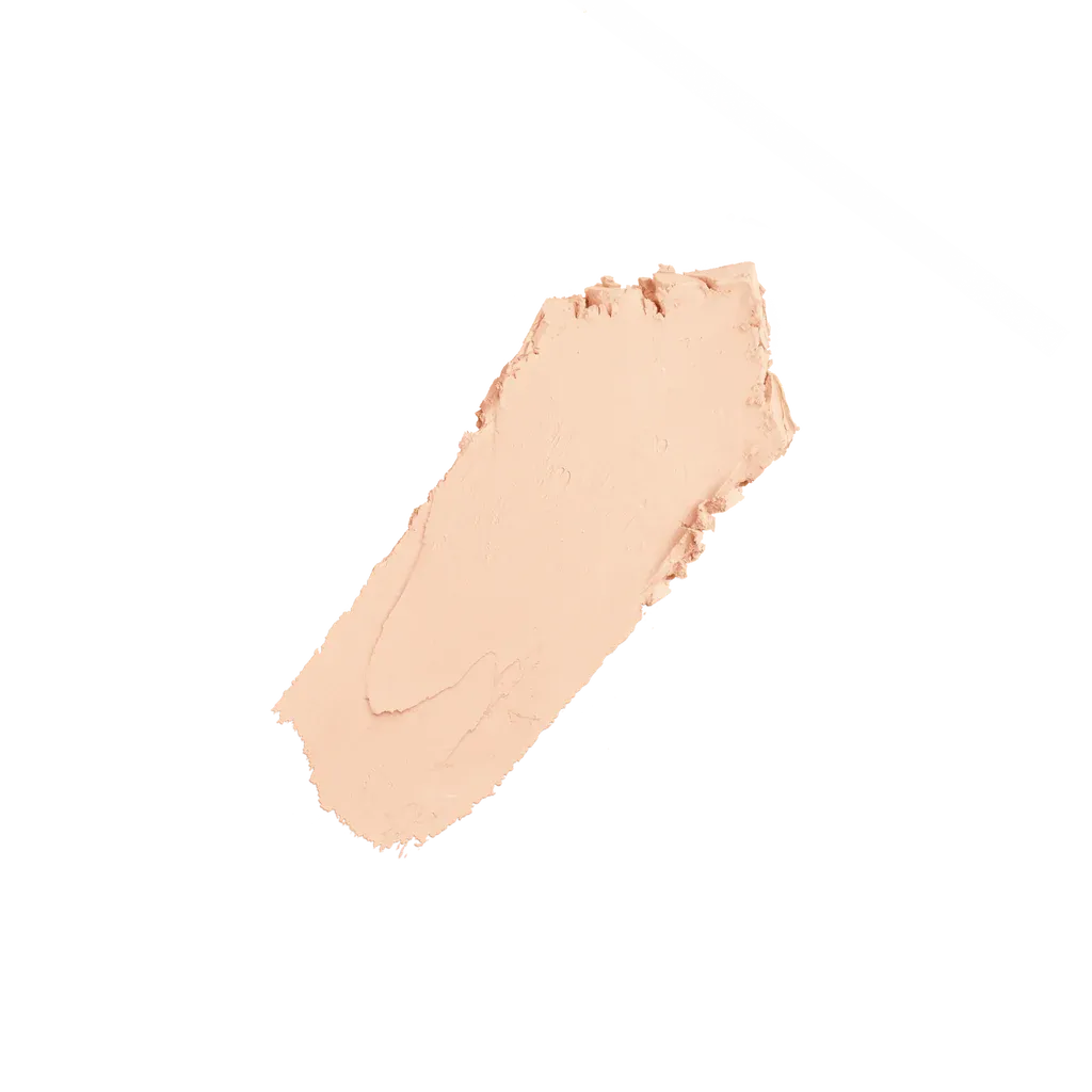 Huda Beauty foundation stick 100B Milkshake swatch on arm showing light coverage