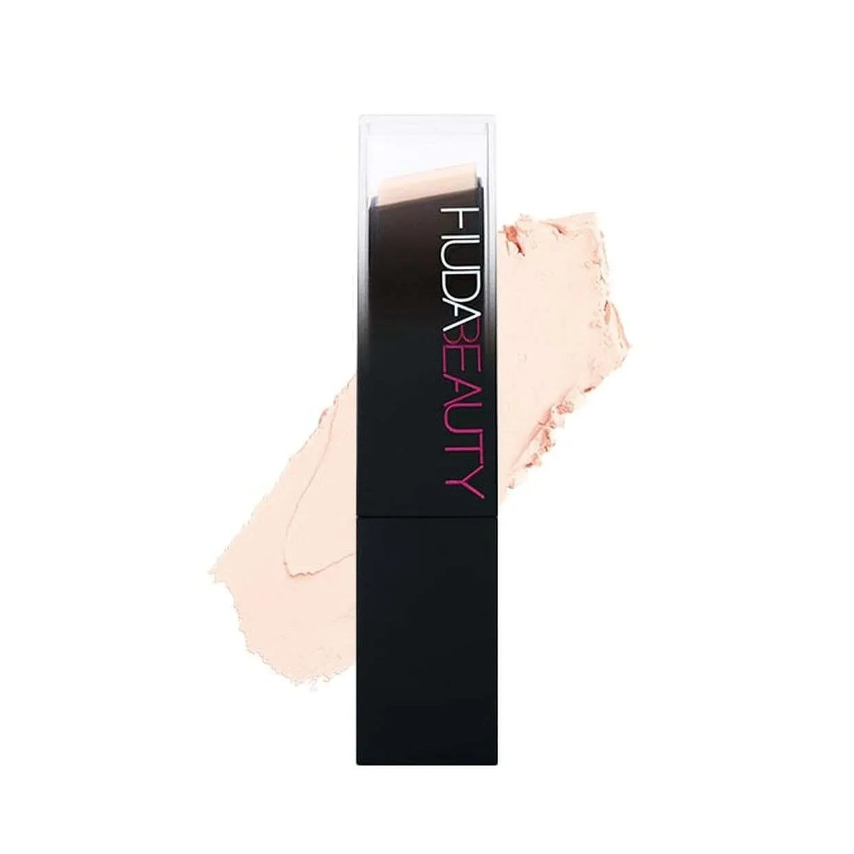 Huda Beauty FauxFilter Skin Finish Foundation Stick in shade 100B Milkshake on white background, front view