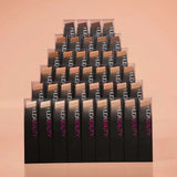 Huda Beauty FauxFilter Foundation Stick 150G Creme Brulee alongside other beauty products