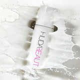 Ultra-fine milky mist of Huda Beauty Glow Coco hydrating spray with coconut water
