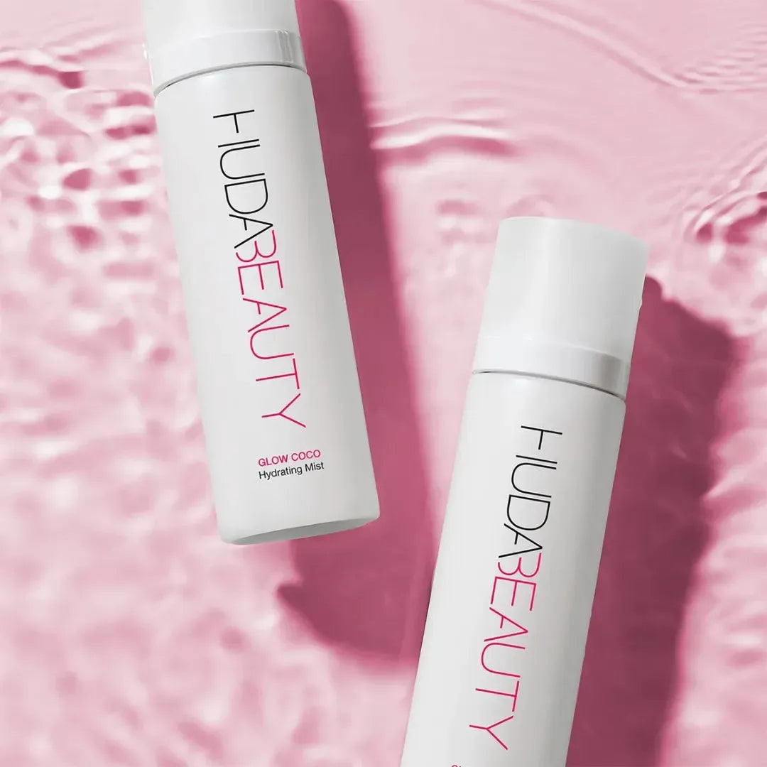 Refreshing Huda Beauty Glow Coco mist applied on face for summer hydration