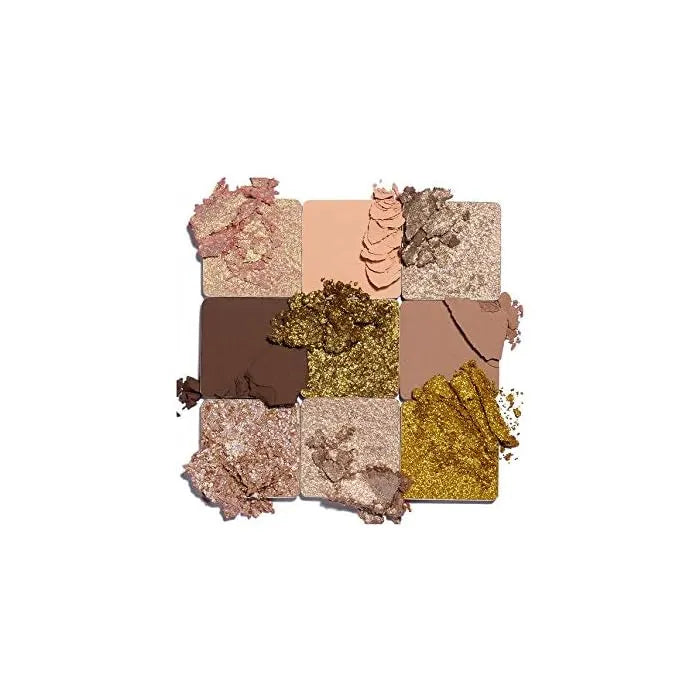 Application of Huda Beauty Gold Obsessions eyeshadow on model's eye with gold shimmer