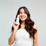 OUAI Leave In Conditioner ingredients list showing tamarind seed extract and panthenol on back of bottle
